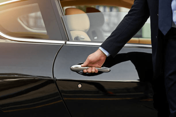 A driver opening the car door