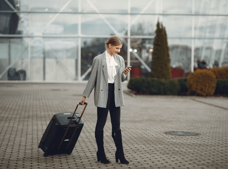 A woman waiting for Southampton taxi service at Southampton airport