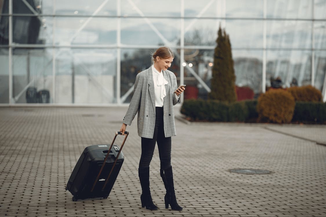 A woman waiting for Southampton taxi service at Southampton airport