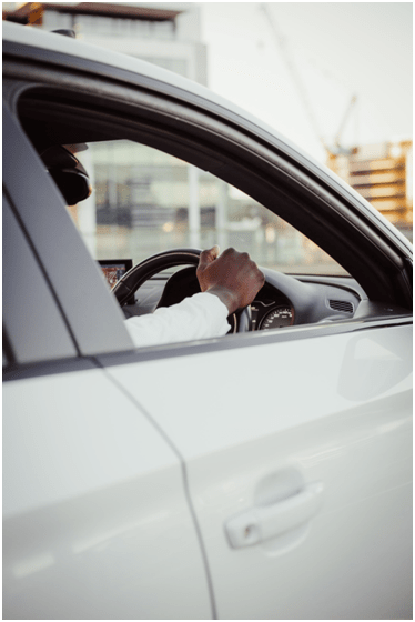 A chauffeur waiting in a car