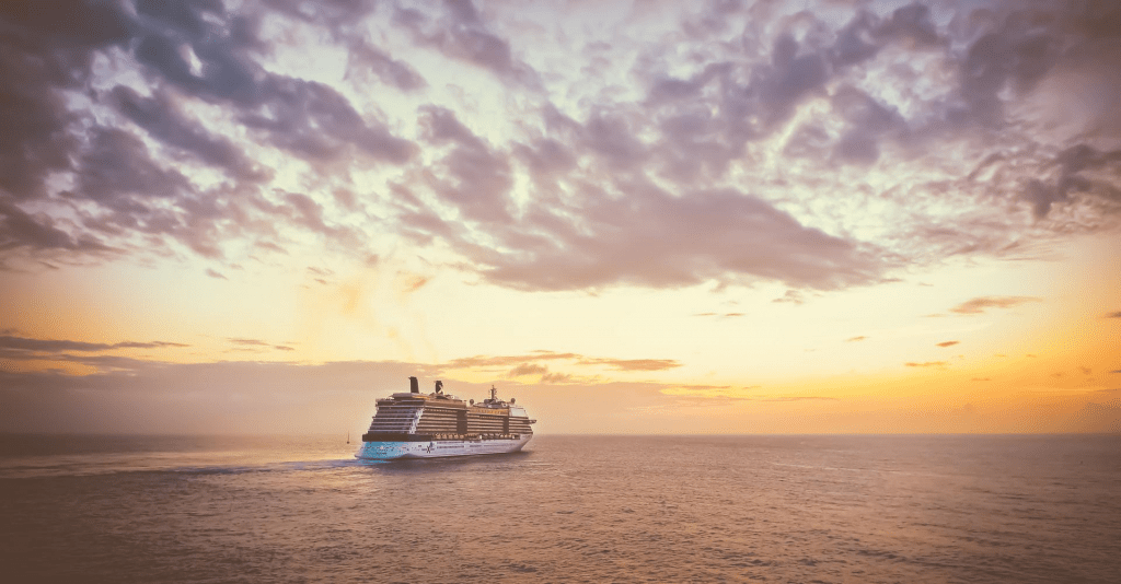 A cruise ship sailing into the sunset