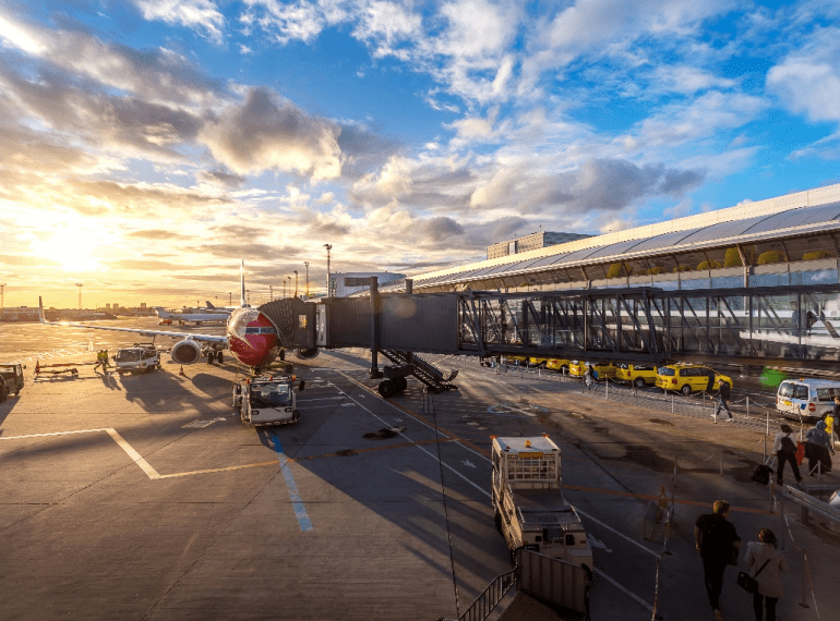 Passengers getting off a plane and ready for an airport transfer