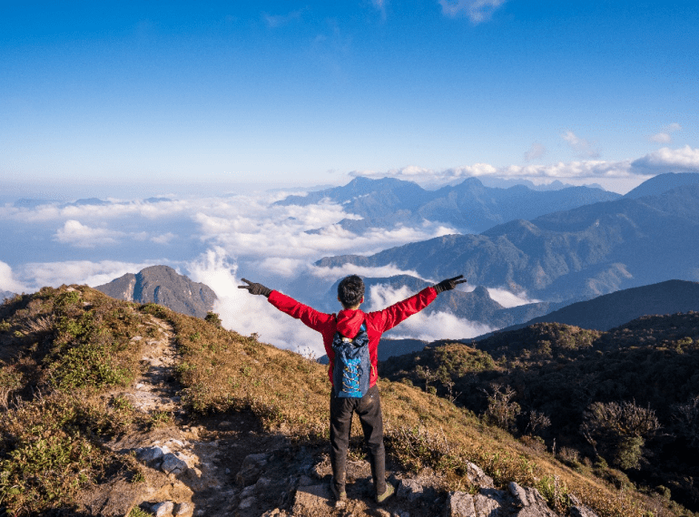 a man standing on top of a mountain