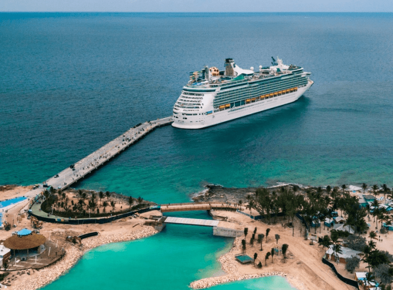 a ship docked at a cruise port