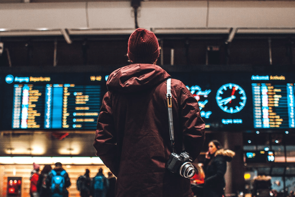 A person is checking flight timings