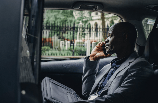 Man sitting in a taxi.