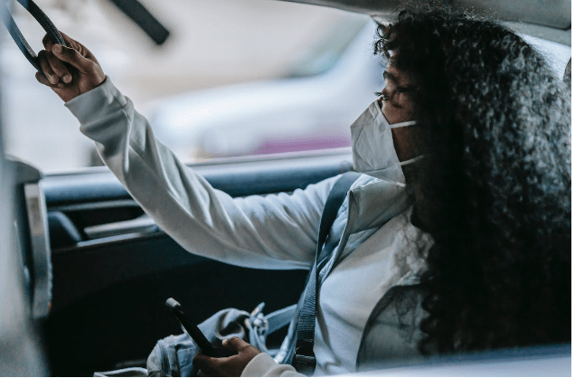 Woman travelling in a taxi.