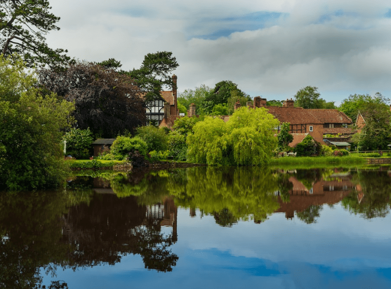 a serene village in Hampshire viewed from an airport taxi’s