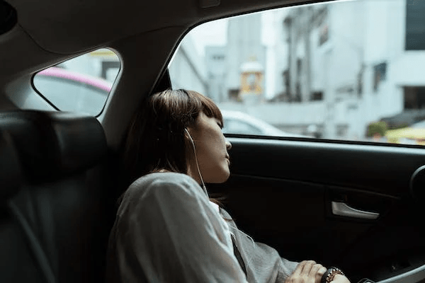 a girl asleep during a car ride