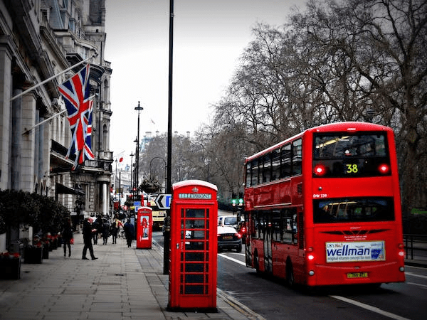 a red bus on the road