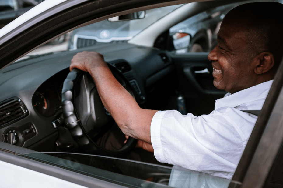 A happy man driving a cab