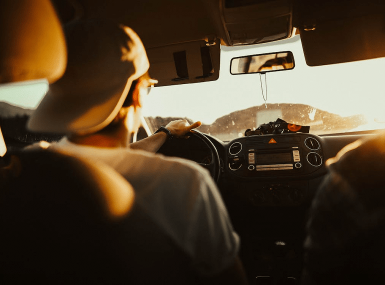 Man holding the steering wheel while driving