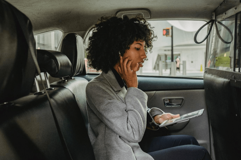 Person in a car going to the airport