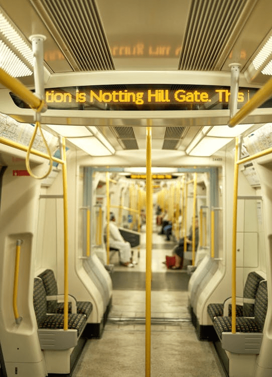 An image of an empty train with white and grey interior