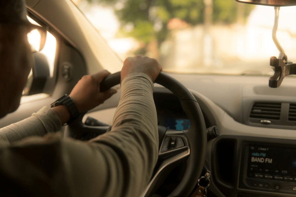 An image of a man driving a car