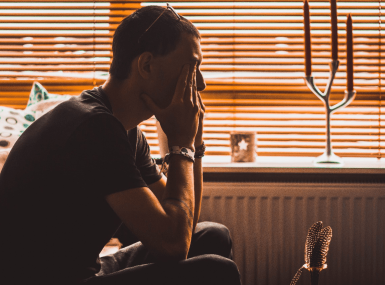 A Person Sitting on a Sofa