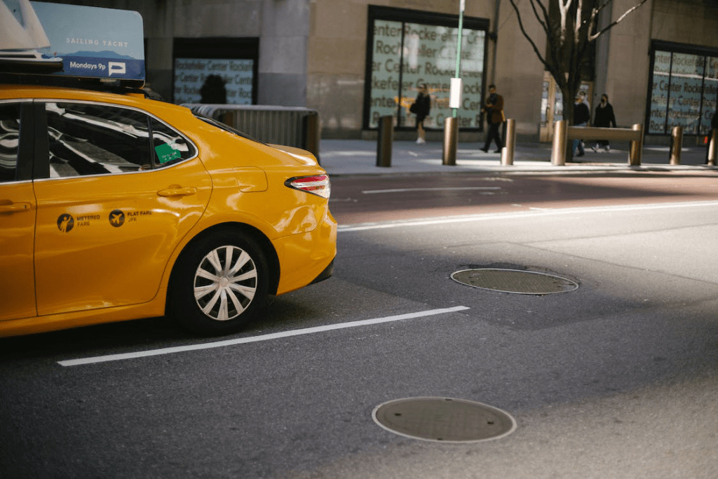 An image of a taxi parked on the side of the road