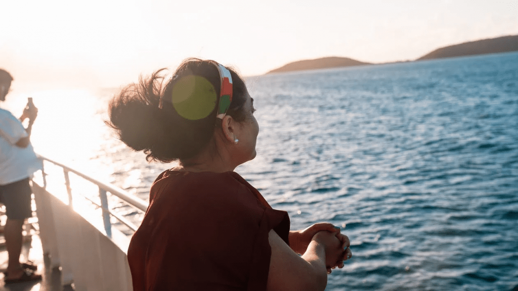 An image of a woman on a cruise ship on the sea