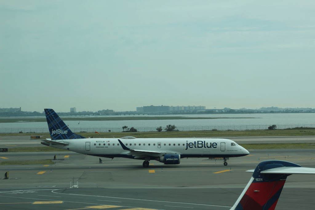 An image of a passenger plane on the tarmac of an airport