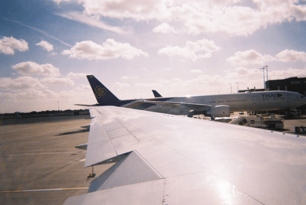 An image of airplanes on an airport runway