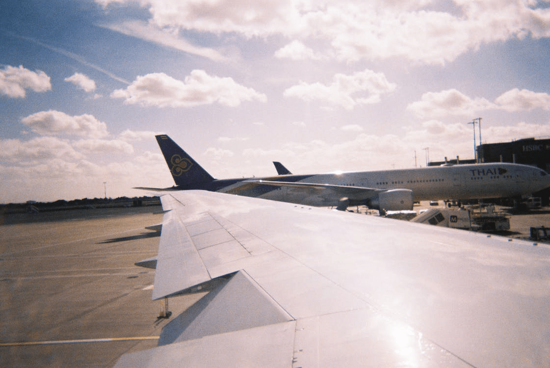 An image of planes on an airport runway